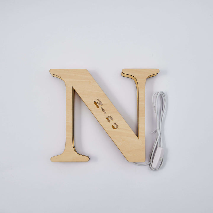 Wooden letter "N" Enchanted Woodland Alphabet Lamp with warm glow for personalized illumination, perfect for nurseries and bedrooms.