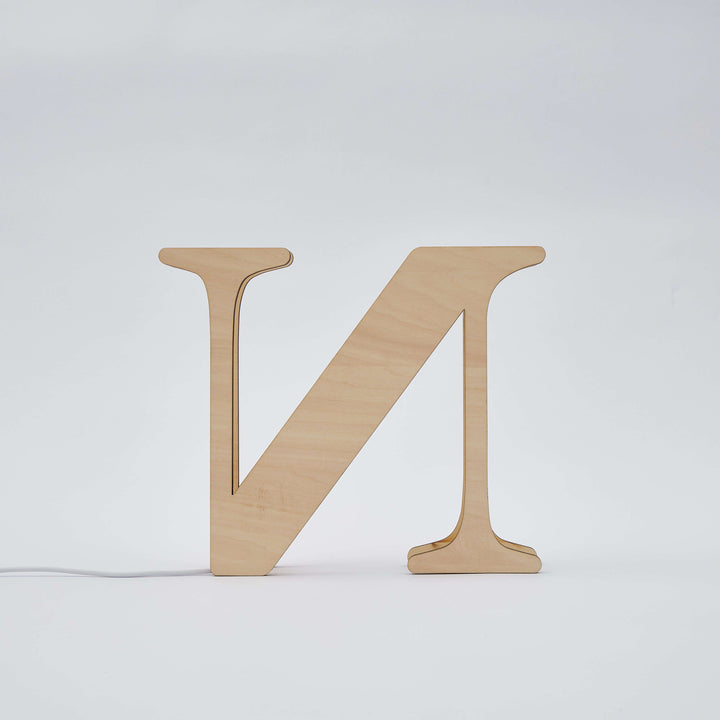 Illuminated wooden letter N from Enchanted Woodland Alphabet Lamp, adding a personalized warm glow to any space.
