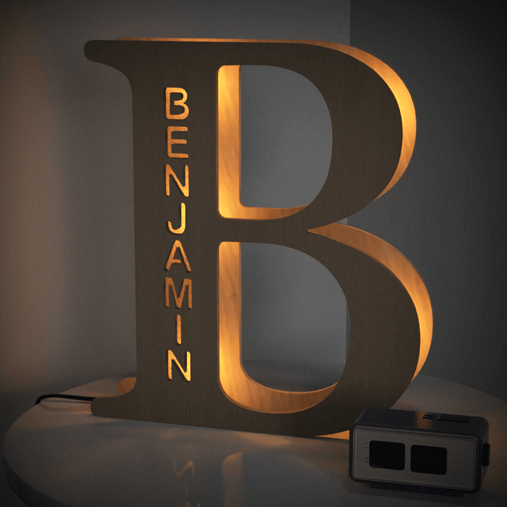 Illuminated wooden letter B night light with the name Benjamin, adding charm and warmth to room decor. Customizable Enchanted Woodland Alphabet Lamp.