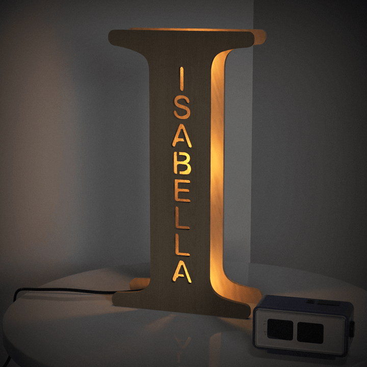 Enchanted Woodland Alphabet Lamp in letter I with name Isabella, 19cm wooden night light lamp illuminating a room with a warm glow