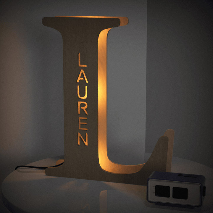 Enchanted Woodland Alphabet Lamp with letter L for Lauren illuminating room with warm glow